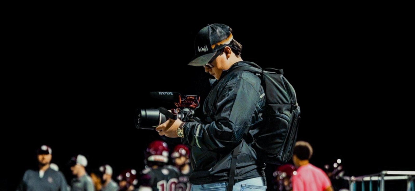 Kaden Moore filming on the sideline